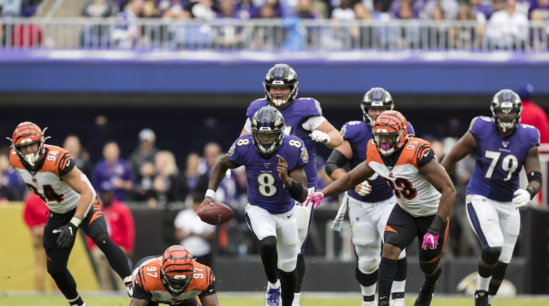 BALTIMORE, MD - OCTOBER 13: Lamar Jackson #8 of the Baltimore Ravens scrambles against the Cincinnati Bengals during the first half at M&T Bank Stadium on October 13, 2019 in Baltimore, Maryland. (Photo by Scott Taetsch/Getty Images)