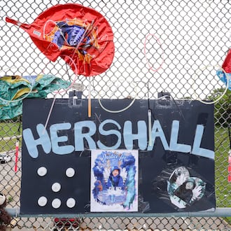 A memorial has been set up on the McClure Street bridge over U.S. 35 for Hershall Creachbaum, a 7-year-old who was found dead on July 12, 2025. Balloons, stuffed animals and signs are among items people have left. BRYANT BILLING / STAFF