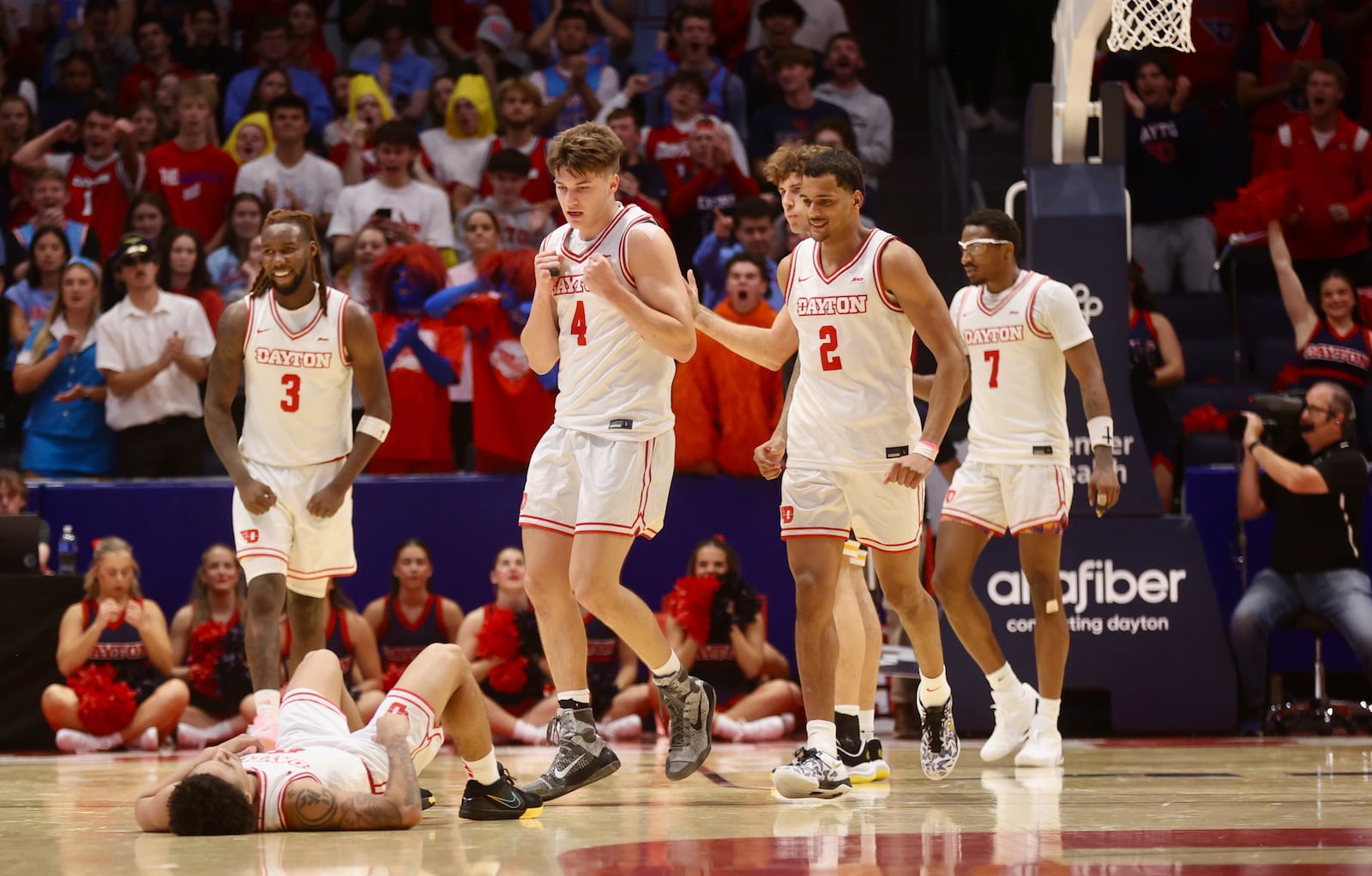 Dayton's Javon Bennett waits for help from his teammates after a fall in the second half against Maryland, Baltimore County on Saturday, Nov. 8, 2025, at UD Arena. David Jablonski/Staff