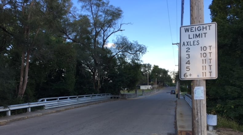Much need improvements to Miamisburg’s Ninth Street Bridge will be completed by this fall. The bridge, built in 1930, is among nearly two-dozen in Montgomery County considered by the 2021 National Bridge Inventory to be in “poor” condition. FILE PHOTO
