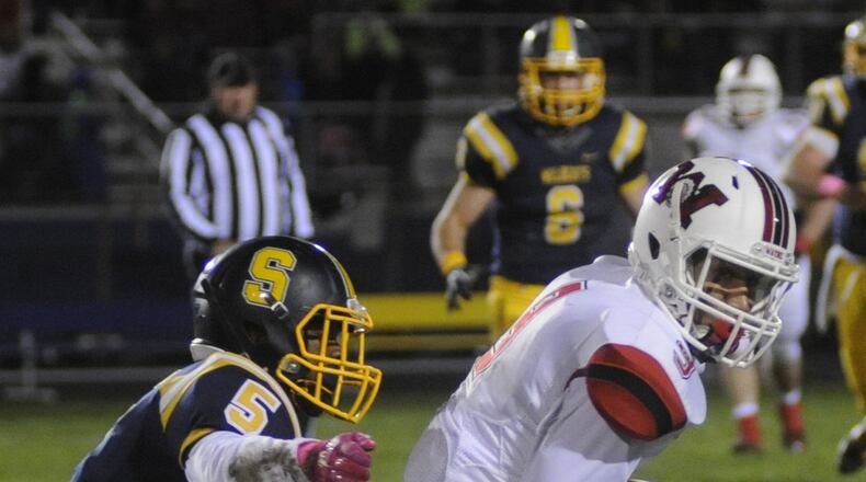Wayne WR L’Christian “Blue” Smith (right) and Springfield DB DeSean Bradley. Wayne defeated host Springfield 38-14 in a Week 9 GWOC National East high school football game at Evans Stadium on Friday, Oct. 21, 2016. MARC PENDLETON / STAFF