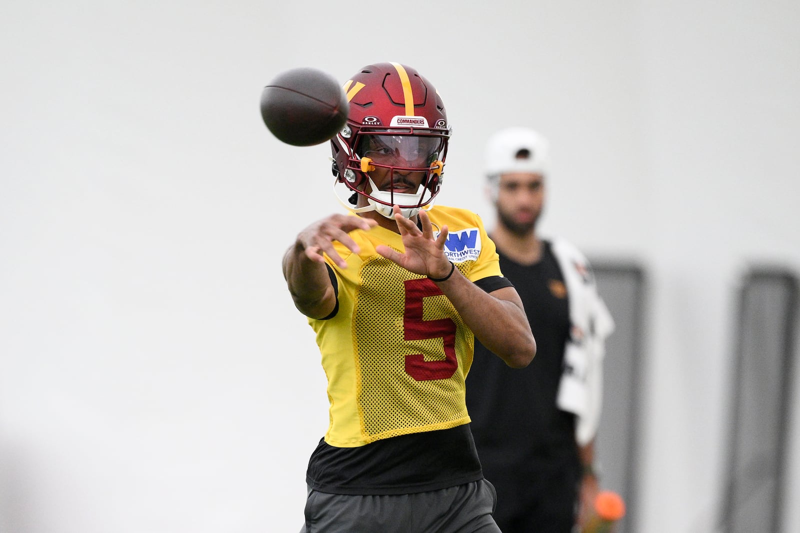 Washington Commanders quarterback Jayden Daniels works out during NFL football practice, Wednesday, May 28, 2025, in Ashburn, Va. (AP Photo/Nick Wass)