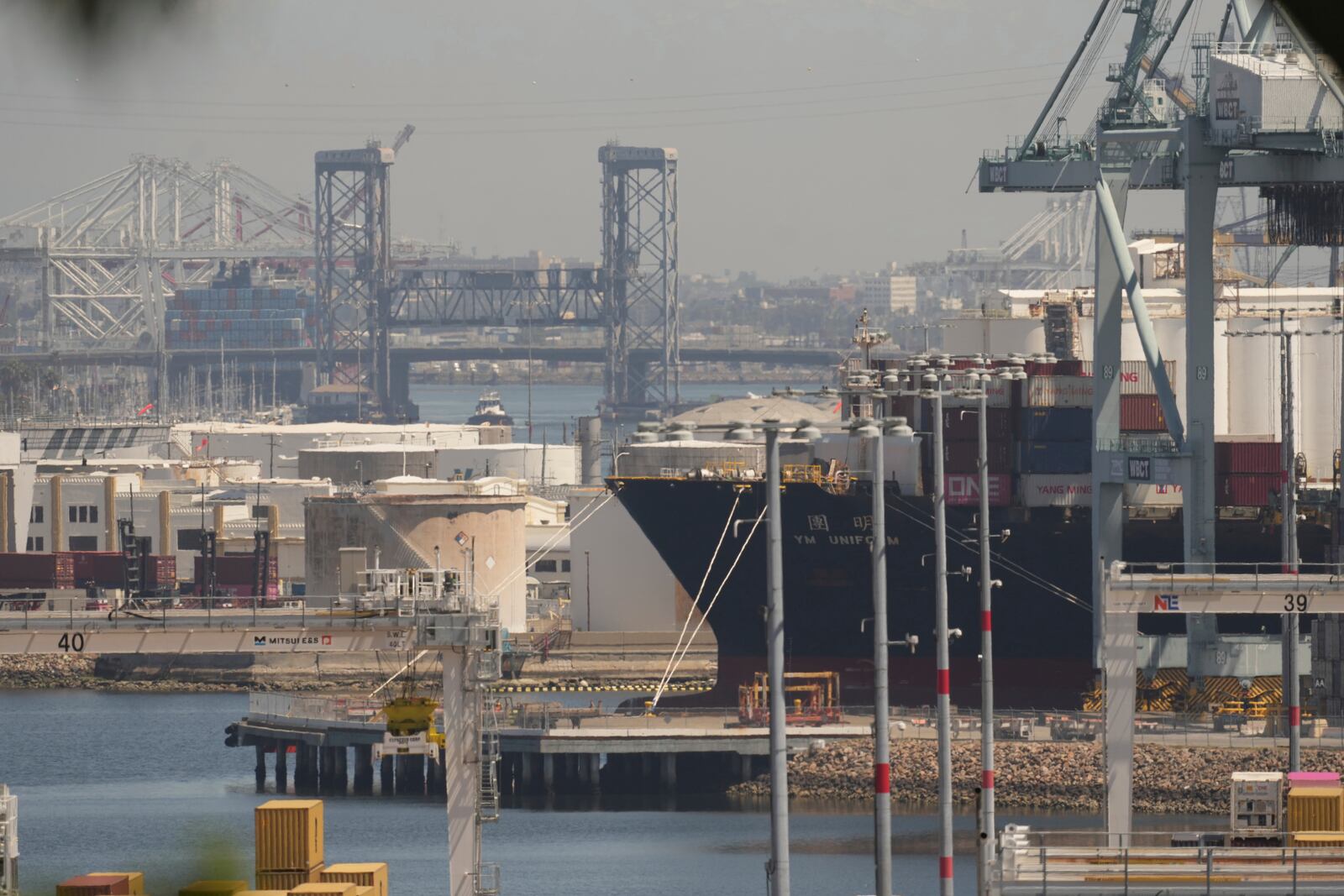 The YM Uniform container ship is docked at the Port of Los Angeles Wednesday, April 9, 2025, in Los Angeles. (AP Photo/Damian Dovarganes)