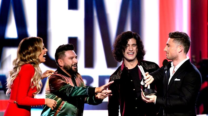 LAS VEGAS, NEVADA - APRIL 07: Carly Pearce (L) and Michael Ray (R) present the Duo of the Year award to Shay Mooney (2nd L) and Dan Smyers (2nd R) of Dan + Shay onstage during the 54th Academy Of Country Music Awards at MGM Grand Garden Arena on April 07, 2019 in Las Vegas, Nevada. (Photo by Kevin Winter/Getty Images)