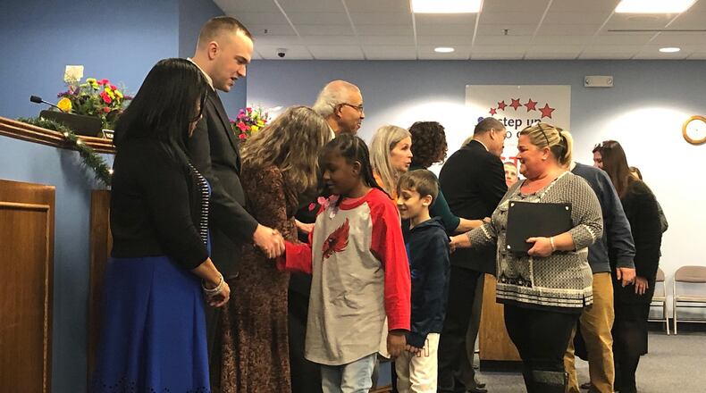 Student winners of Dayton Public Schools’ Math Olympics program were honored at a school board meeting Dec. 17, 2019. JEREMY P. KELLEY / STAFF