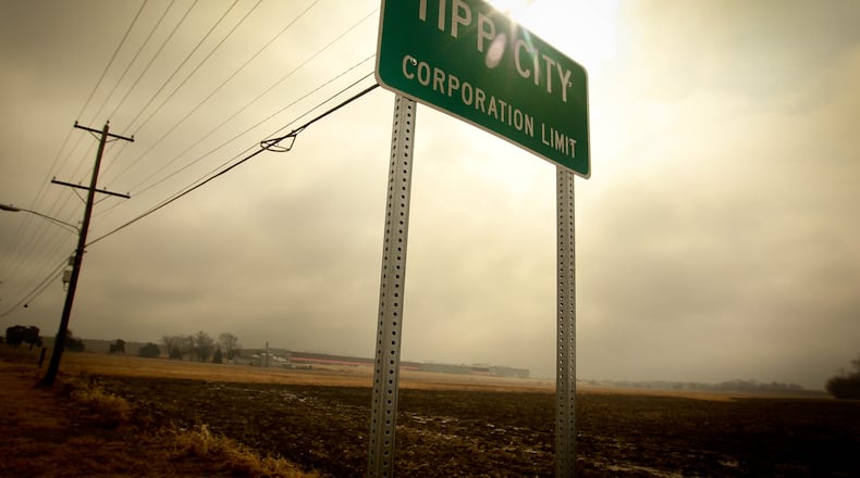 The existing Meijer distribution center in the distance behind the Tipp City limits sign. JIM WITMER/STAFF