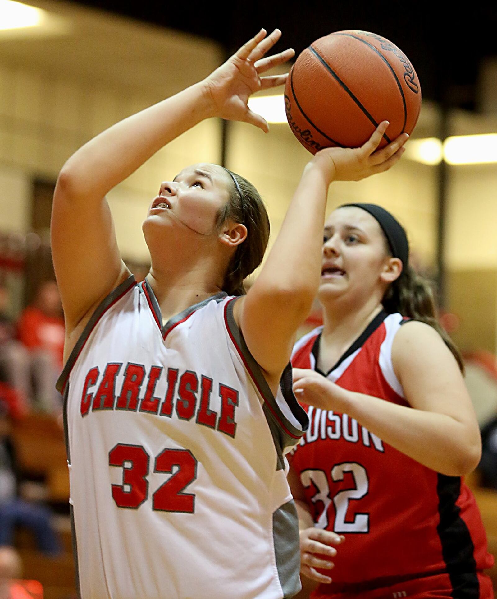Carlisle center Cami Glover beats Madison’s Lauren Dietz to the basket during their game Saturday afternoon at Carlisle. CONTRIBUTED PHOTO BY E.L. HUBBARD