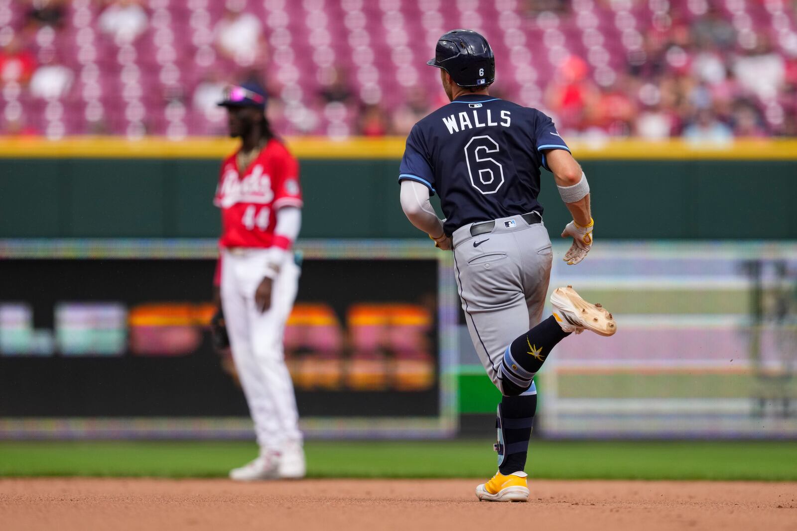 Tampa Bay Rays' Taylor Walls (6) rounds the bases after hitting a solo home run during the eighth inning of a baseball game against the Cincinnati Reds, Sunday, July 27, 2025, in Cincinnati. (AP Photo/Jeff Dean)