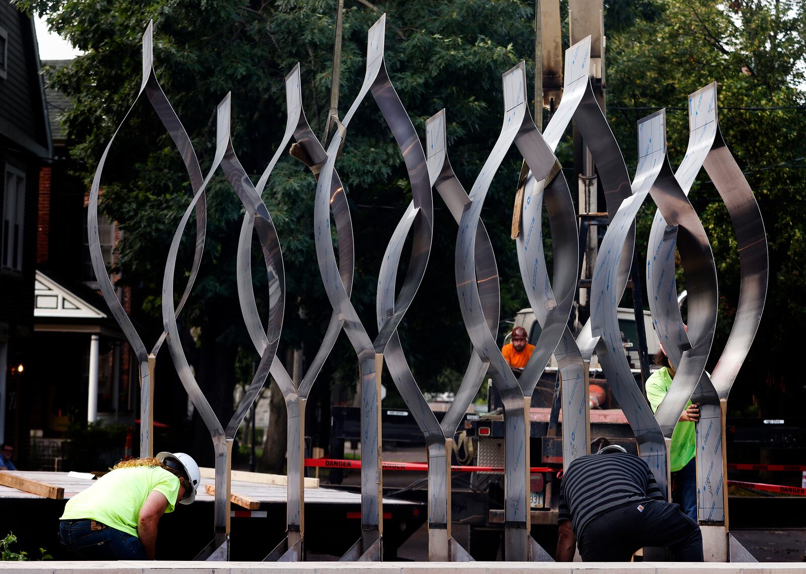 The Seed of Life sculpture for the Oregon District shooting memorial was craned in Thursday, July 25, 2024. MARSHALL GORBY\STAFF