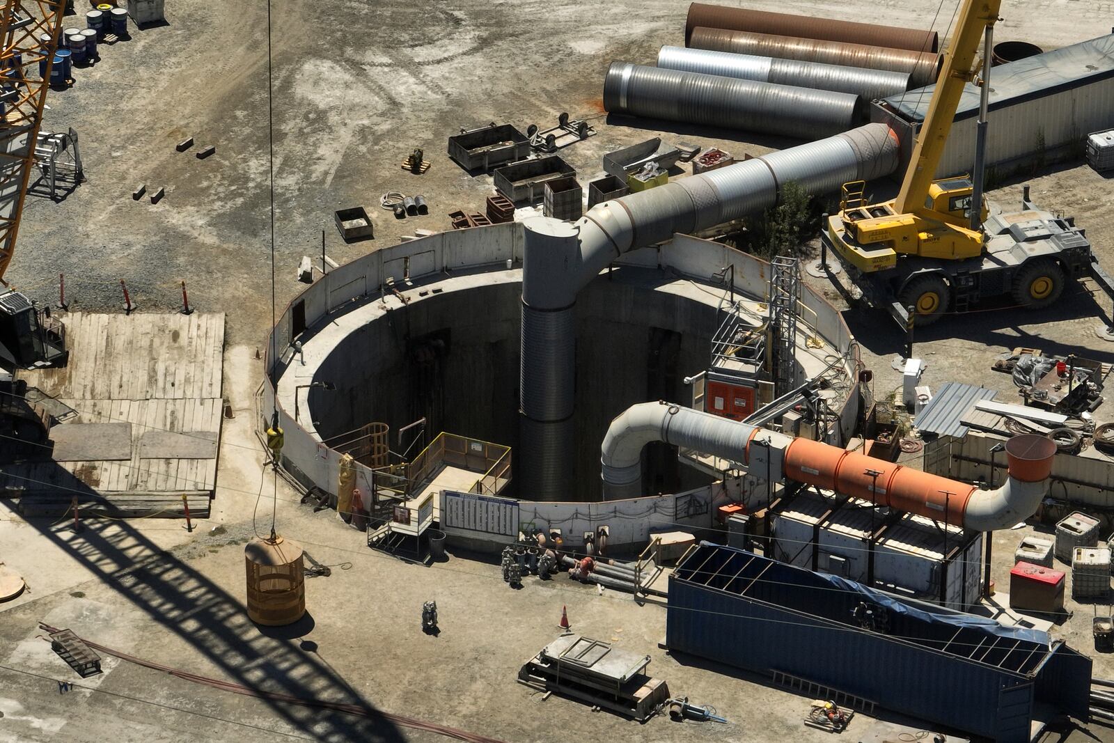 An aerial view shows the only entrance to an industrial tunnel in the Wilmington neighborhood of Los Angeles, Thursday, July 10, 2025, after a section of the tunnel partially collapsed Wednesday night. (AP Photo/Jae C. Hong)