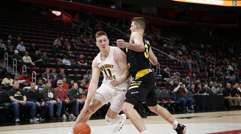 Wright State’s Loudon Love looks to drive past NKU’s Drew McDonald during the Horizon League championship game Tuesday, March 12, 2019, at Little Caesars Arena in Detroit. Jose Juarez/CONTRIBUTED