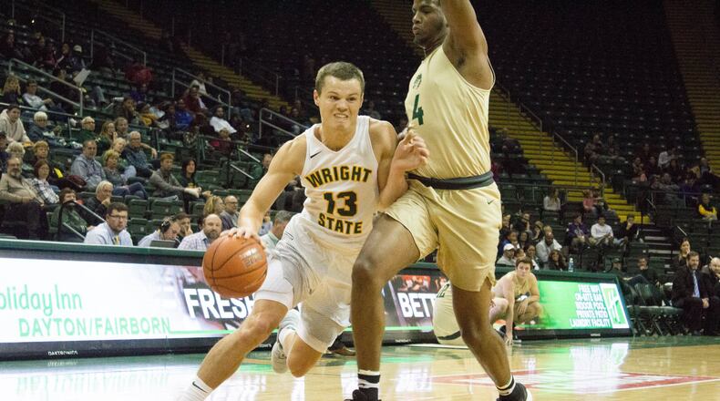 Wright State’s Grant Benzinger looks to drive around Tiffin’s Quentin Jones during Monday’s game at the Nutter Center. Benzinger went over 1,000 career points in the win. ALLISON RODRIGUEZ/CONTRIBUTED