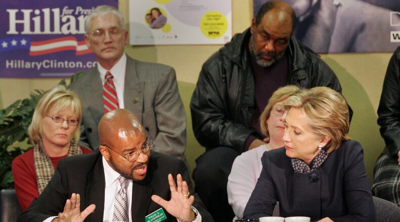 Montgomery County Recorder Willis Blackshear tells Democratic presidential candidate Sen. Hillary Clinton about the issue of local housing foreclosures as she brought her campaign to the Miami Valley in 2008, meeting with local people caught in the crisis. Staff photo by Chris Stewart
