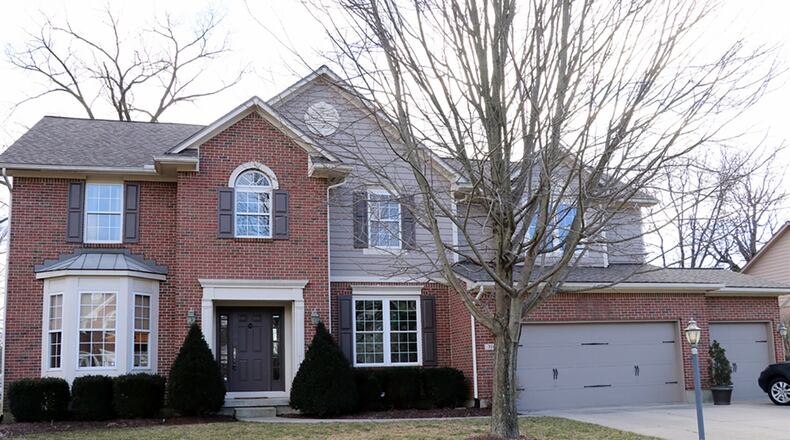 The brick 2-story has a finished basement with bar, gas fireplace, media room and full bathrooms. On the main level, the great room has a vaulted ceiling with open staircase that ends at a loft family room and hallway to the 4 bedrooms. CONTRIBUTED PHOTOS BY KATHY TYLER