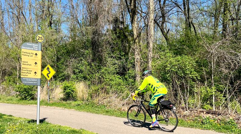 A bicyclist uses the multi-use trail in Taylorsville MetroPark on a sunny April 18, 2024. AIMEE HANCOCK / STAFF