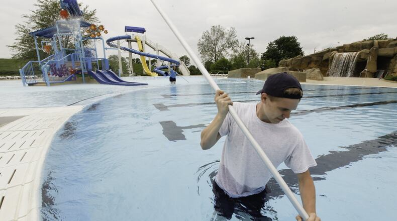 Employees at the Kettering Recreation Complex work Thursday, May 23, preparing Adventure Reef for its opening to the public today (SATURDAY, MAY 25). CHRIS STEWART / STAFF