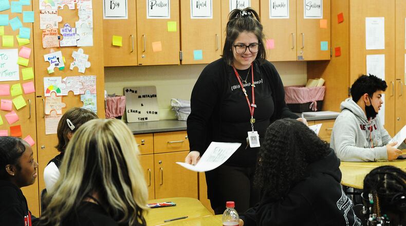 Wayne High School teacher Kaylee Robins teaches a financial literacy course that won an award from the Ohio State Treasurer last year. Huber Heights is one of the districts that has a financial literacy class requirement.  MARSHALL GORBY\STAFF