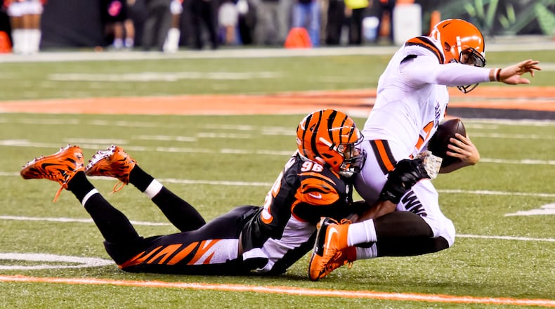 Cincinnati Bengals defensive end Carlos Dunlap sacks Cleveland Browns quarterback Johnny Manziel during the Bengals' 31-10 victory Thursday, Nov. 5 at Paul Brown Stadium in Cincinnati. The Bengals are now 8-0 on the season.  NICK GRAHAM/STAFF