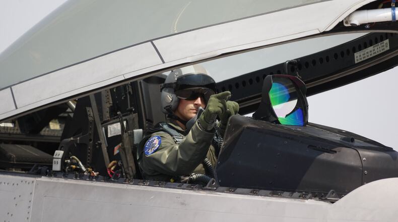 F-22 Raptor demostration pilot Maj. Paul “Max” Moga prepared for flight before he took to the sky at the 2008 Vectren Dayton Air Show. TY GREENLEES / STAFF FILE PHOTO