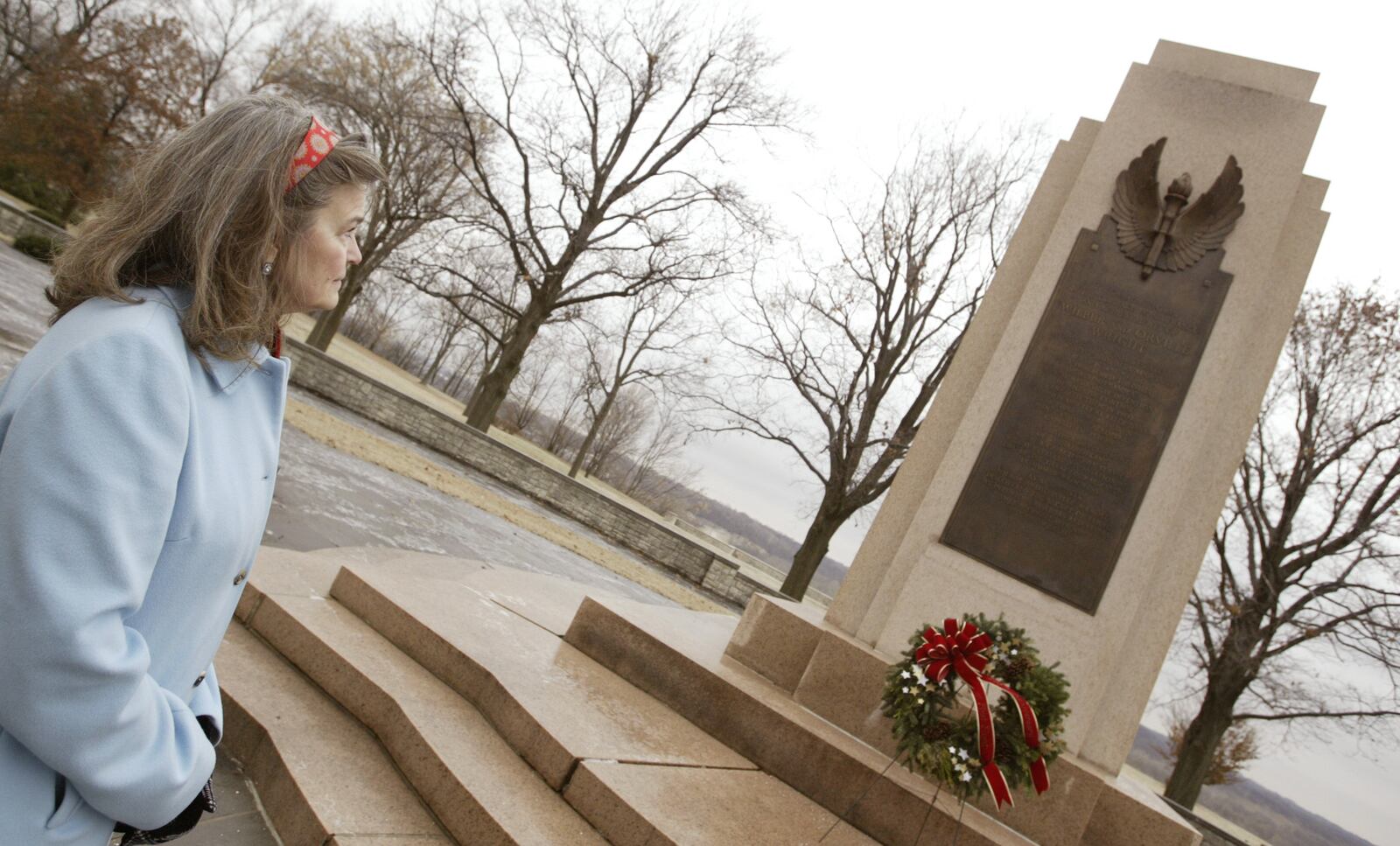 Amanda Wright Lane, the great grandniece of Wilbur and Orville Wright, stands in front of Wright Brother's Memorial at Huffman Prairie Flying Field Interpretive Center on Wednesday Dec. 17. The year 2009 will mark accomplishments by the Wright Brothers, the 100th anniversary of the Wrights' Homecoming Parade in Dayton in June 1909 the brothers retuned from a very sucessful trip in Europe and also the same year, 1909, Wrights' sold their first airplane to the US Signal Corps. The National Aviation Heritage Alliance is planning many events and programs to mark the anniversary.