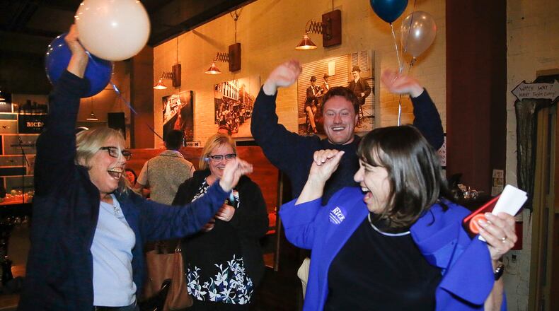 Carolyn Rice, right, a Democrat and current Montgomery County treasurer, celebrates her election Tuesday as a Montgomery County commissioner. TY GREENLEES / STAFF