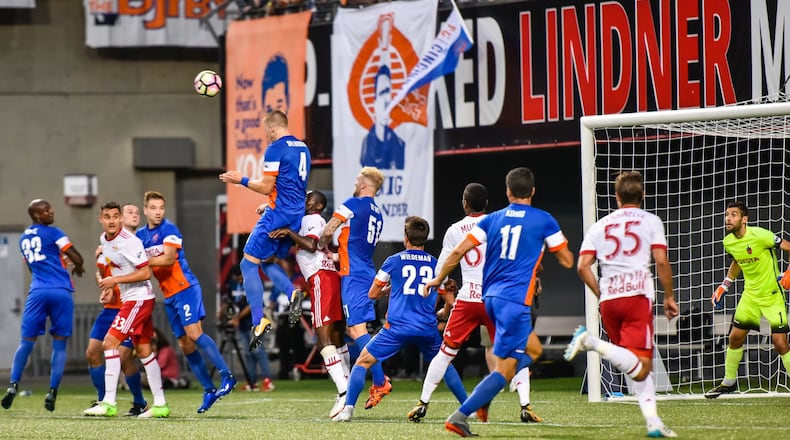 FC Cincinnati’s Harrison Delbridge jumps up for a header during their 2017 Lamar Hunt U.S. Open Cup semifinal game against New York Red Bulls Tuesday, Aug. 15 at Nippert Stadium on the University of Cincinnati Campus in Cincinnati. NICK GRAHAM/STAFF