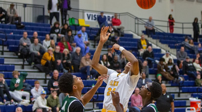 Centerville's Baboucarr Njie is fouled by Isidore Newman's Chris Cenac Jr. with eight seconds left to set up the Elks' winning free throws. Jeff Gilbert/CONTRIBUTED