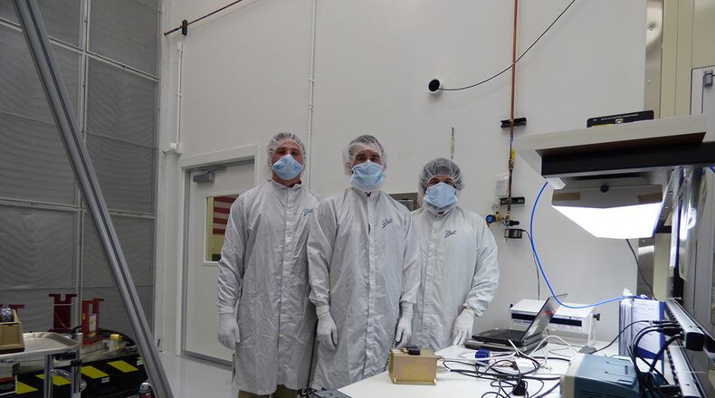 Air Force Institute of Technology’s Center for Space Research and Assurance team members complete final checkout of the Space Object Self-Tracker experiment. The SOS, launched in June 2019, is a self-sufficient, low-cost, low-weight and low-power system that demonstrates precise orbit tracking capabilities for use in future Space Domain Awareness and Space Traffic Management applications. The payload is now fully operational and provides daily data messages, containing its current position and velocity in space. AFIT’s CSRA designed, manufactured and tested the payload through one of several collaborative efforts. (Contributed photo/AFIT CSRA)