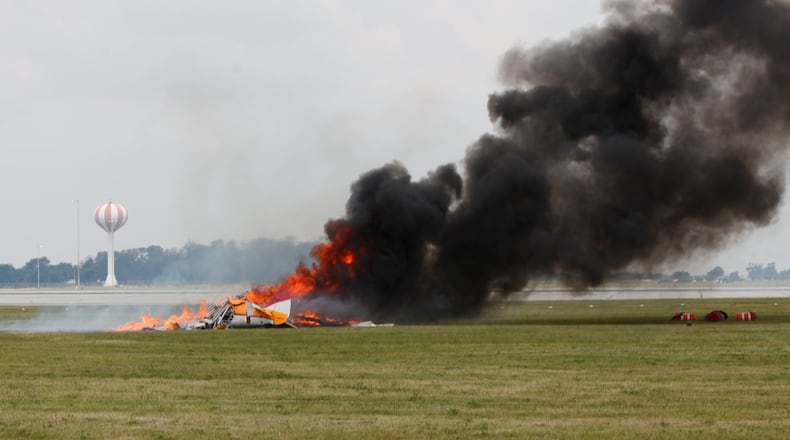Since 1990, there have been 160 crashes at air shows and air races across America. Not a single year during that time was there not a crash.  Wingwalker Jane Wicker, 46, and pilot Charlie Schwenker, 64, crashed and were killed at the Vectren Dayton Air Show on Saturday, June 22.  The biplane appears to have crashed just inside the 500-foot show line which is marked by orange construction barrels seen at right.  TY GREENLEES / STAFF