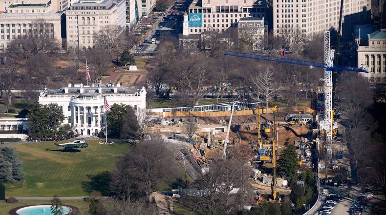 FILE - Marine One, with President Donald Trump aboard, lifts off the South Lawn, Tuesday, Jan. 13, 2006 at the White House in Washington. The new ballroom construction can be seen on the right. (AP Photo/Pablo Martinez Monsivais, File)
