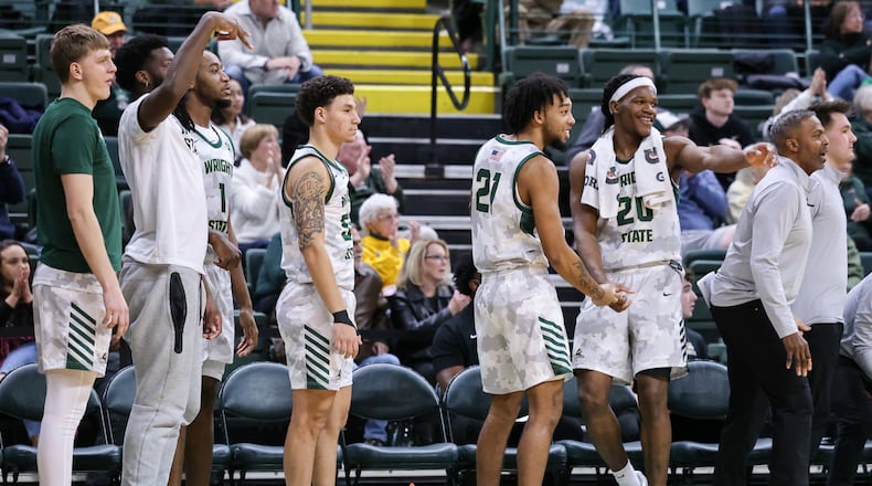 Wright State players on the bench cheer after a play during a Horizon League game against Youngstown State on Thursday, Jan. 15 at Ervin J. Nutter Center in Fairborn. BRYANT BILLING/STAFF