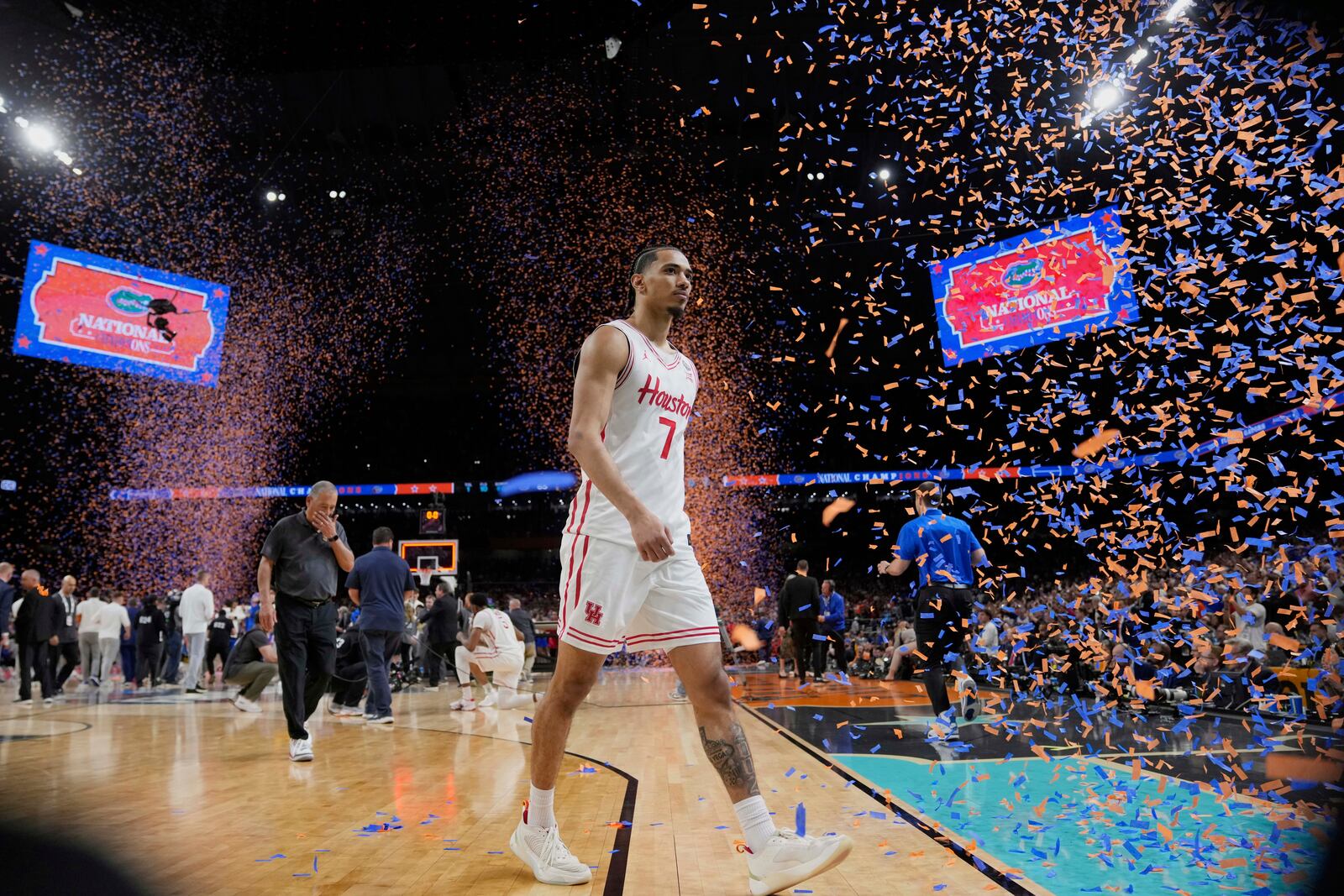 Houston's Milos Uzan (7) leaves the court after Florida beat Houston in the national championship at the Final Four of the NCAA college basketball tournament, Monday, April 7, 2025, in San Antonio. (AP Photo/Eric Gay)