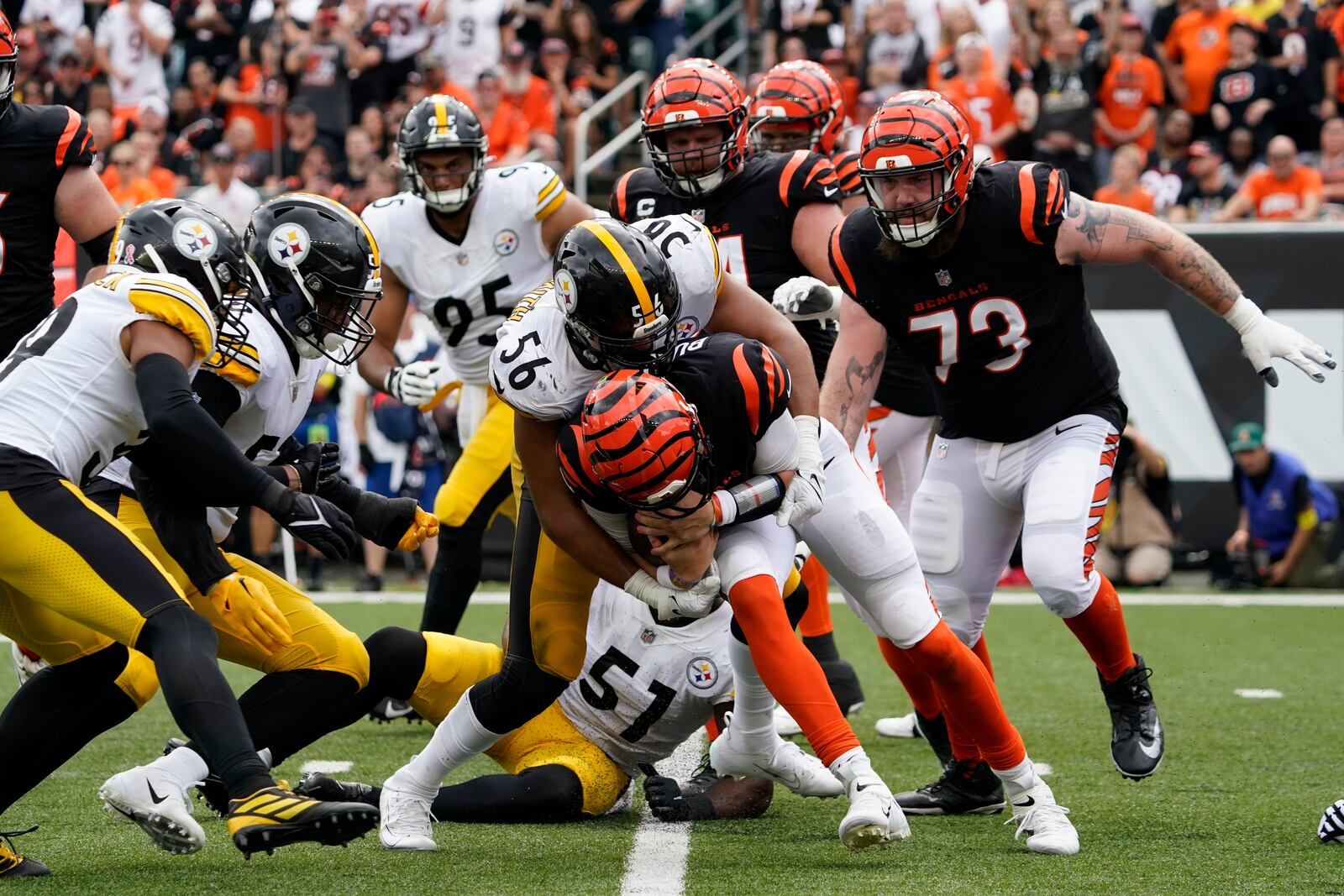 Pittsburgh Steelers linebacker Alex Highsmith (56) sacks Cincinnati Bengals quarterback Joe Burrow, center bottom, during the second half of an NFL football game, Sunday, Sept. 11, 2022, in Cincinnati. (AP Photo/Joshua A. Bickel)