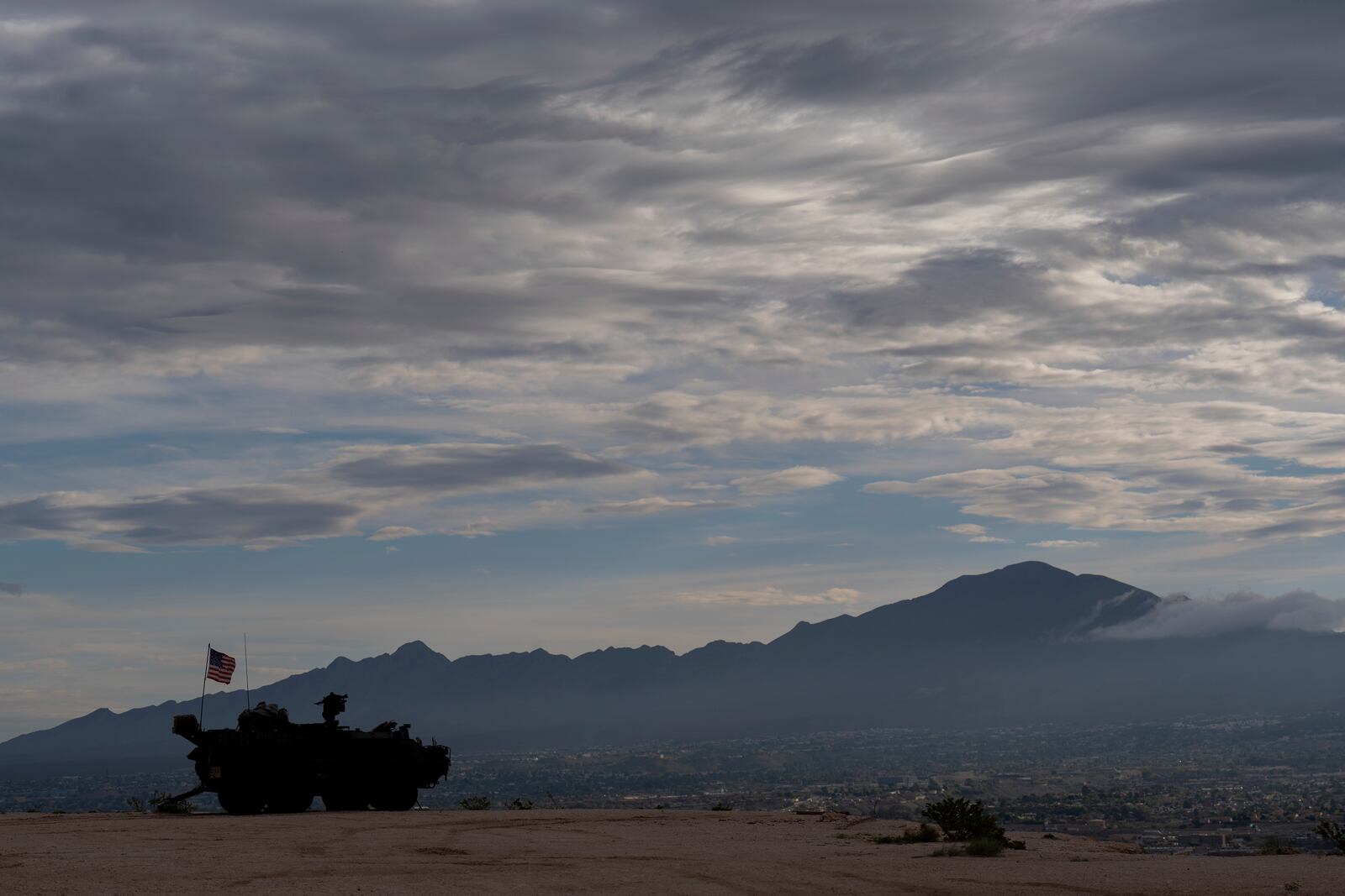 A Stryker combat vehicle sits atop a hill overlooking the U.S.-Mexico border fence in Sunland Park, N.M., Wednesday, July 23, 2025. (AP Photo/Jae C. Hong)