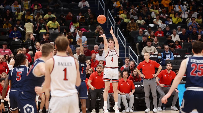 Davidson's Mike Loughnane makes a 3-pointer in the final minutes against Richmond in the first round of the Atlantic 10 Conference tournament on Wednesday, March 12, 2025, at Capital One Arena in Washington, D.C. David Jablonski/Staff