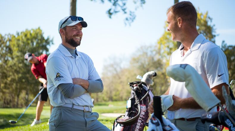 Wright State coach Conner Lash (left) talks to senior Bryce Haney during the Dayton Flyer Invitational in October at NCR Country Club. Joseph Craven/Wright State Athletics