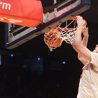 Dayton's Amaël L'Etang dunks against Liberty on Saturday, Dec. 20, 2025, at UD Arena. David Jablonski/Staff