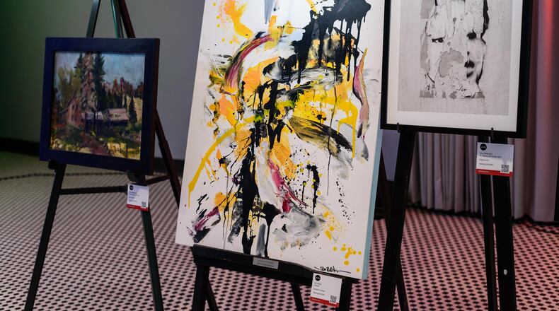 The Contemporary Dayton celebrated the 30th anniversary of its annual art auction in the Dayton Arcade’s rotunda and The Contemporary’s galleries on Friday, Apr. 26, 2024. Over 80 local artists donated their work which included paintings, photography, prints and sculptures to The Co’s signature fundraiser for attendees to browse, bid and buy. Proceeds directly fund future exhibitions and education programs. TOM GILLIAM / CONTRIBUTING PHOTOGRAPHER