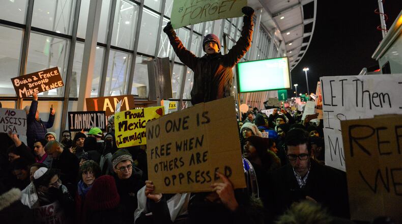 NEW YORK, NY - JANUARY 28: Protestors rally during a demonstration against the new immigration ban issued by President Donald Trump at John F. Kennedy International Airport on January 28, 2017 in New York City. President Trump signed the controversial executive order that halted refugees and residents from predominantly Muslim countries from entering the United States. (Photo by Stephanie Keith/Getty Images)