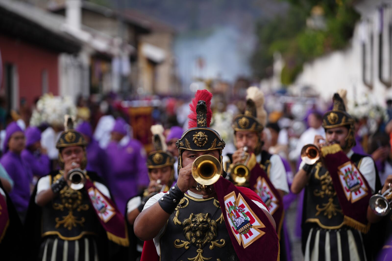 Musicians dressed as Roman soldiers play during a Lenten season procession in Antigua, Guatemala, Sunday, April 6, 2025. (AP Photo/Santiago Billy)