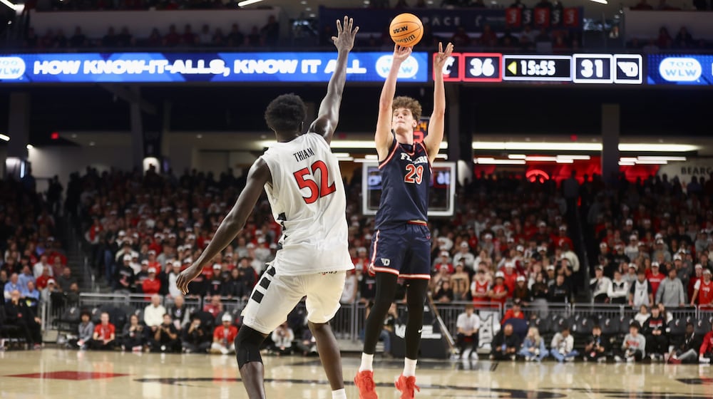 Dayton's Amael L'Etang shoots against Cincinnati on Tuesday, Nov. 11, 2025, at Fifth Third Arena in Cincinnati. David Jablonski/Staff