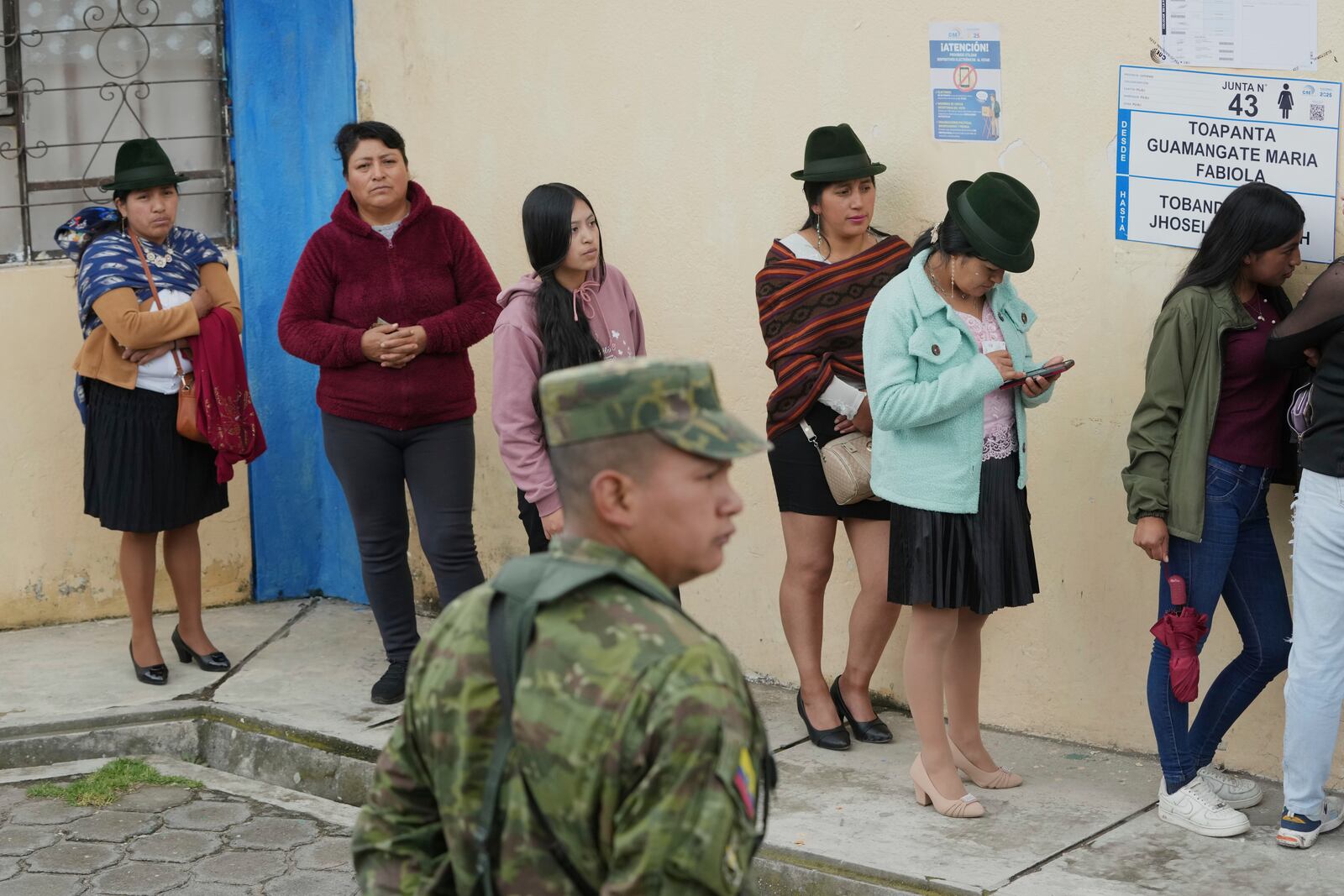 People lines to vote in the presidential election runoff in Pujili, Ecuador, Sunday, April 13, 2025. (AP Photo/Dolores Ochoa)
