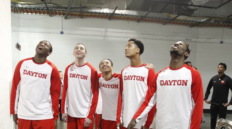 Dayton’s players watch the end of the Oklahoma vs. Albany game as they wait to take the floor before a game against Providence in the second round of the NCAA tournament on Friday, March 20, 2015, at Nationwide Arena in Columbus. David Jablonski/Staff
