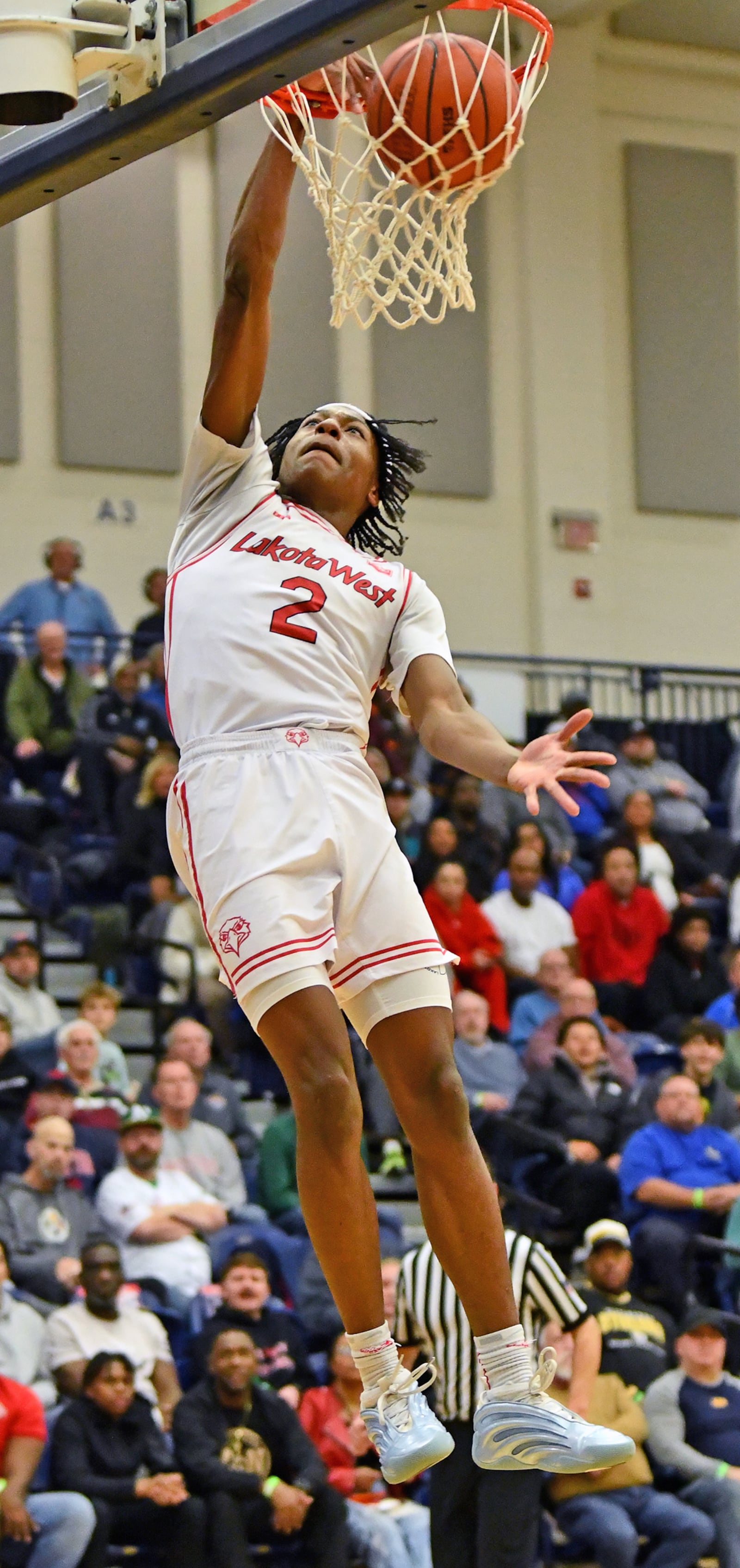 Joshua Tyson dunks for two of his 28 points during Lakota West's 72-71 overtime loss to La Lumiere on Sunday at Flyin' To The Hoop at Fairmont High School's Trent Arena. Jeff Gilbert/CONTRIBUTED
