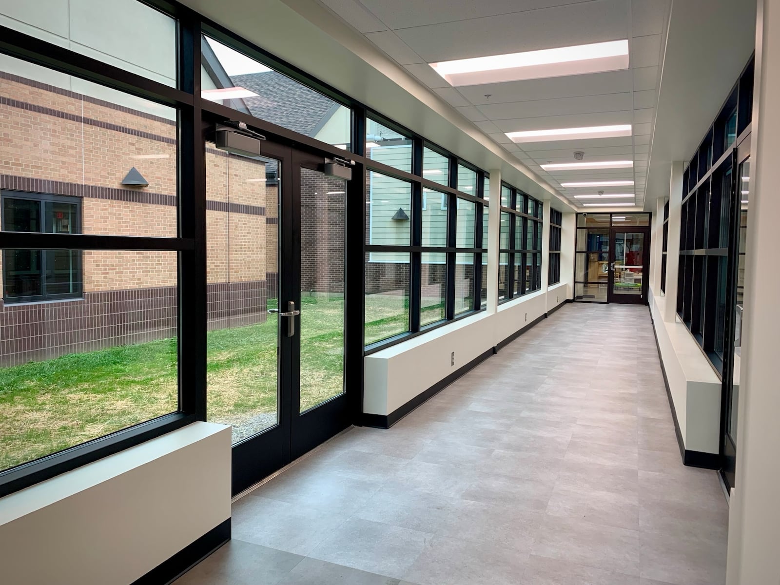 A glass breezeway between the old preschool facilities and the newly renovated preschool classrooms at Beavercreek City Schools provides for the safe passage of children between the two buildings. LONDON BISHOP/STAFF