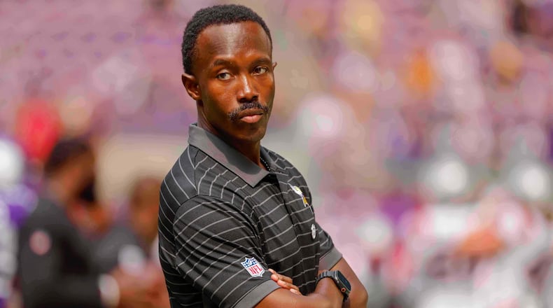 FILE - Minnesota Vikings general manager Kwesi Adofo-Mensah watches his team prepare before the start of a preseason NFL football game against the New England Patriots Saturday, Aug. 16, 2025, in Minneapolis. (AP Photo/Bruce Kluckhohn, File)