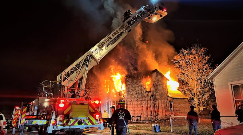 Dayton firefighters respond to a December structure fire on Hoch Street in East Dayton. CORNELIUS FROLIK / STAFF