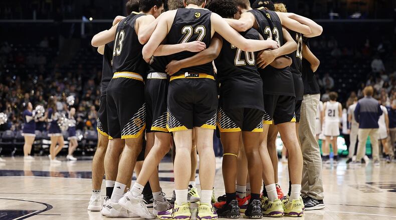 Centerville huddles during their Division I regional basketball game against Kettering Fairmont Wednesday, March 9, 2022 at Cintas Center on the Xavier University campus in Cincinnati. Centerville won 44-42. GRAHAM/STAFF