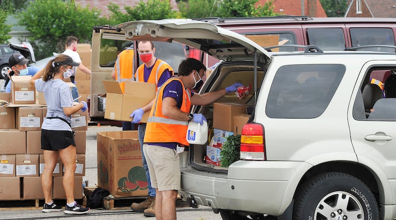 The Foodbank held a mass food distribution at Welcome Stadium on Thursday, Aug. 27, 2020. STAFF PHOTO / MARSHALL GORBY