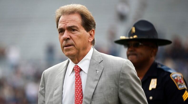 Alabama head coach Nick Saban walks the field before the Iron Bowl NCAA college football game against Auburn, Saturday, Nov. 25, 2017, in Auburn, Ala. (AP Photo/Brynn Anderson)